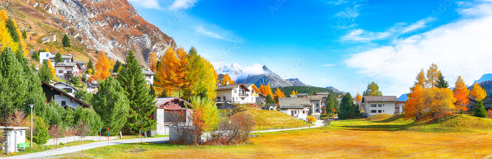 Awesome autumn scene in Maloja village  on the shore of Sils lake(Silsersee)