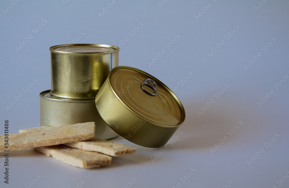 Konsenvirovanny products in metal tins. The isolated object on a white background. Konsenvirovanny products in metal tins. The isolated object on a white background.