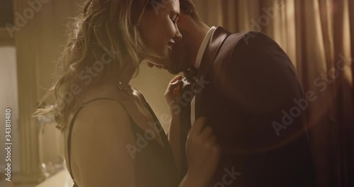 Elegant and stylish couple dancing at a party. Loving young man and woman sharing a sensuous moment at a party.
