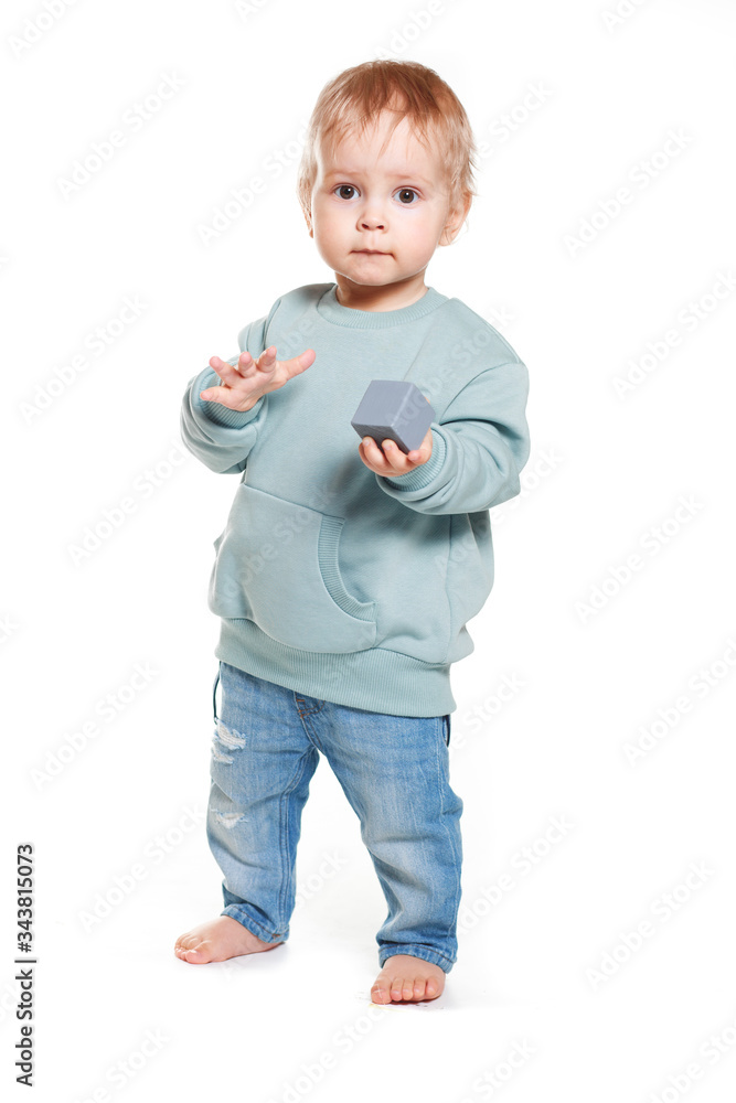 Fashionable portrait of a charming baby boy in a mint sweatshirt Fashionable portrait of a charming baby boy in a mint sweatshirt