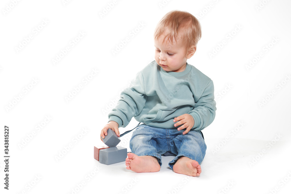 Fashionable portrait of a charming baby boy in a mint sweatshirt Fashionable portrait of a charming baby boy in a mint sweatshirt