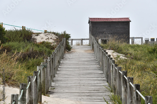 wooden bridge over river, photo as a background , in north portugal, europe , In Afife, Viana do Castelo, north portugal. photo