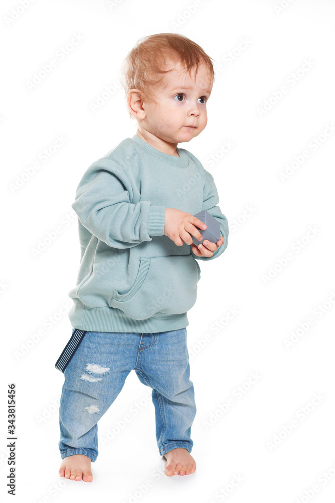 Fashionable portrait of a charming baby boy in a mint sweatshirt Fashionable portrait of a charming baby boy in a mint sweatshirt