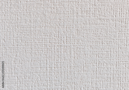 Beige wallpaper with an embossed striped texture.
