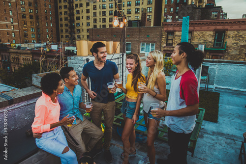 Photography Group of friends having party on a rooftop