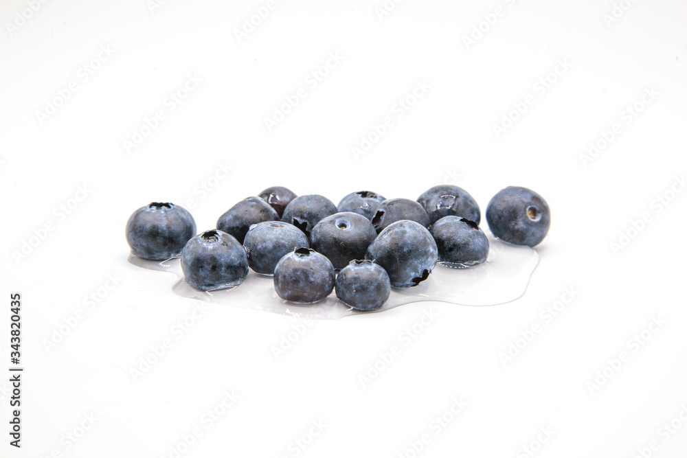 blueberries on white background and water blueberries on white background and water