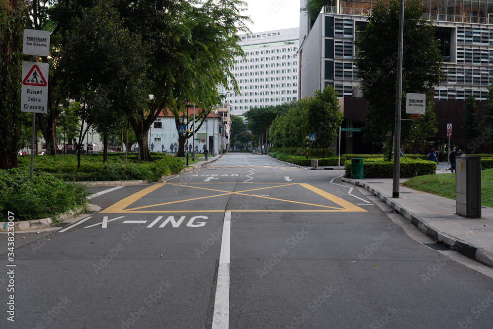 Quiet Singapore street with less tourists and cars during the city lockdown called