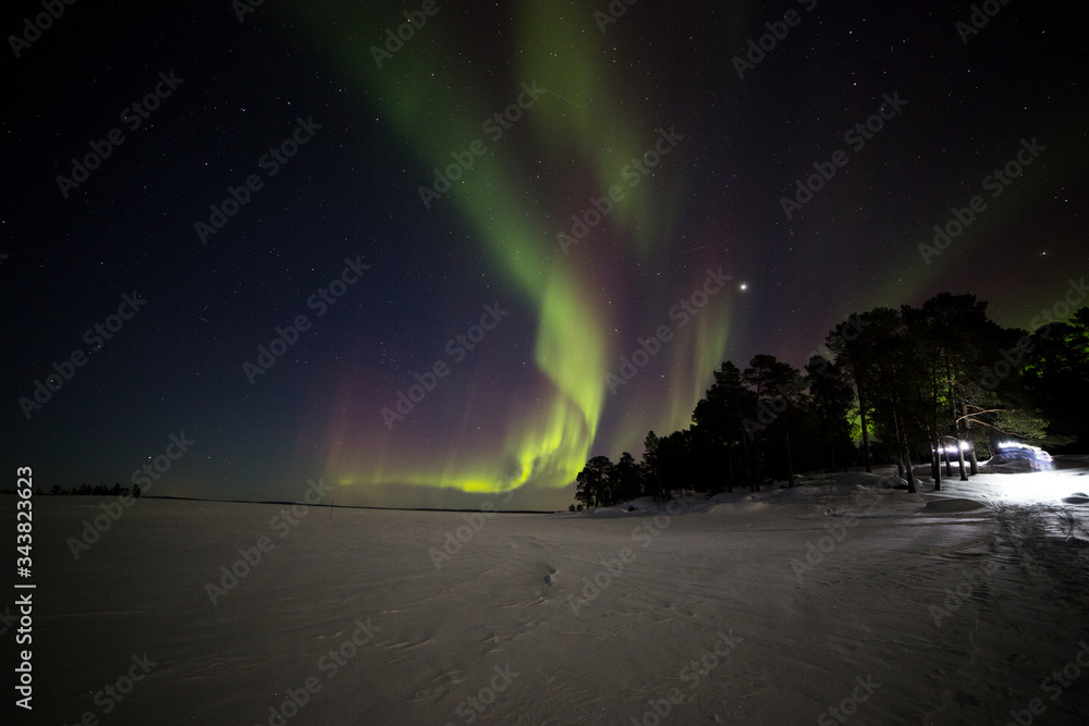 Northern lights in Inari Lake, Lapland, Finland