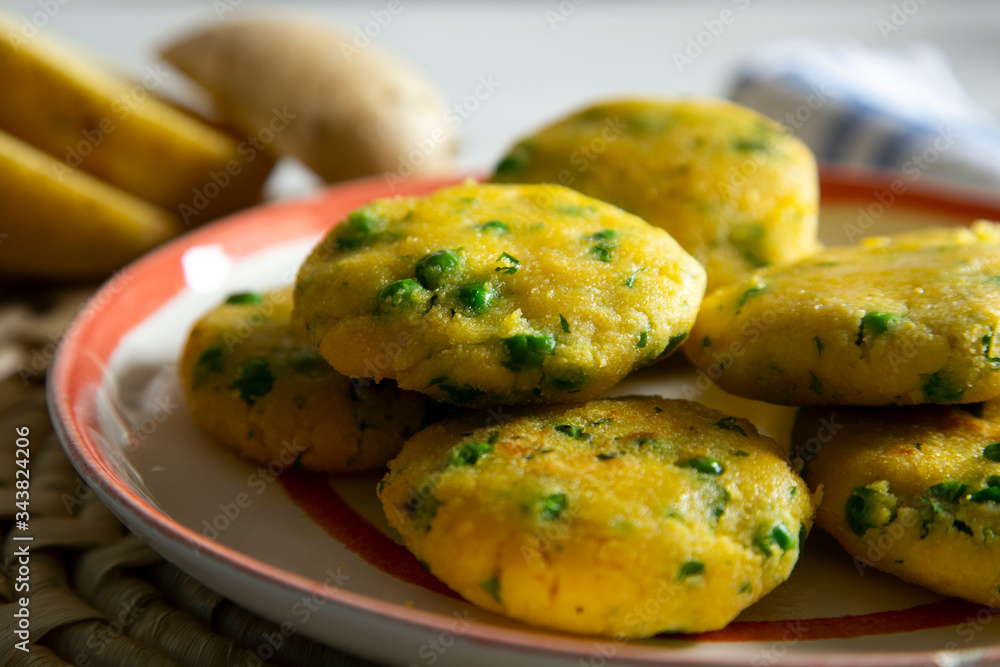 Fototapeta premium Potato cupcakes with peas and lime