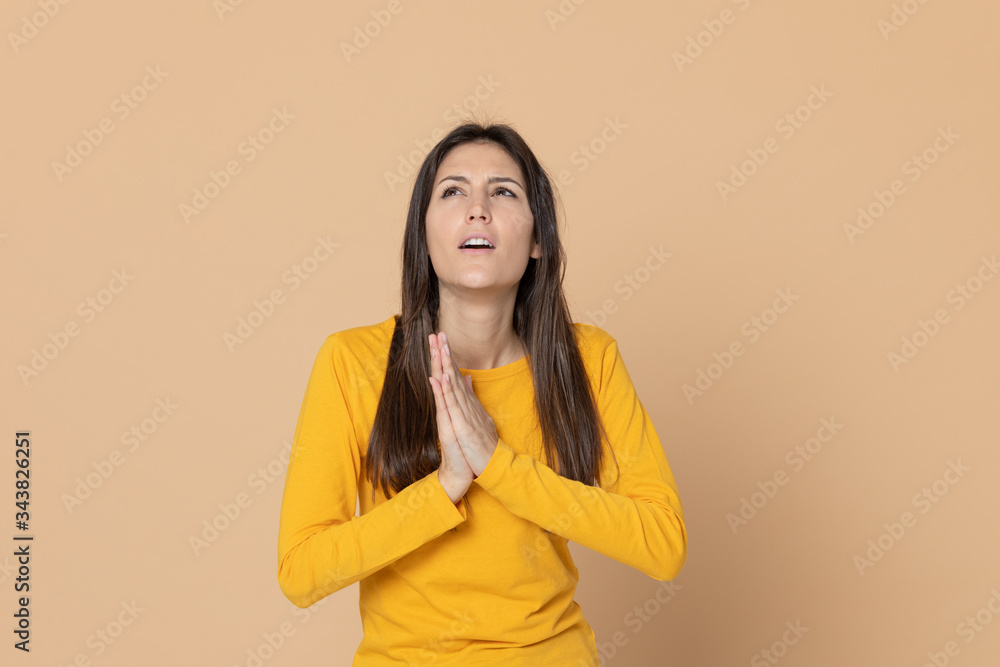 Brunette young woman wearing a yellow T-shirt Brunette young woman wearing a yellow T-shirt