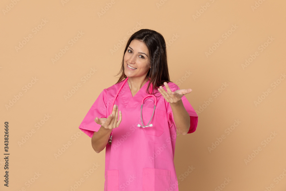 Young doctor with a pink uniform Young doctor with a pink uniform