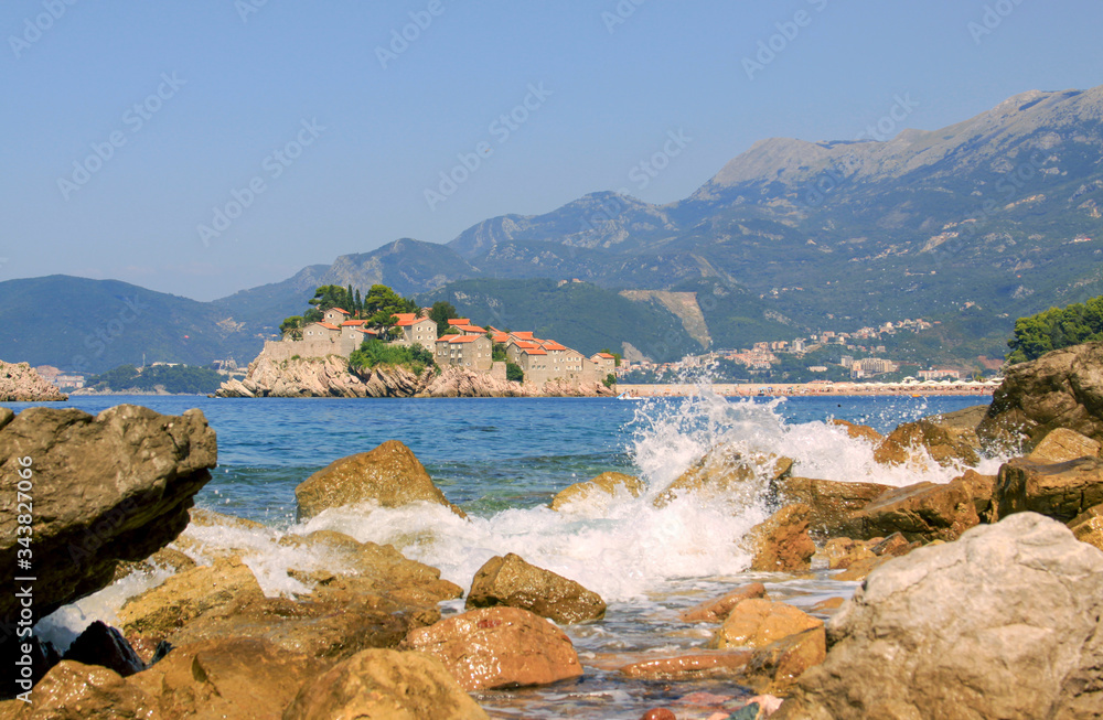 Fototapeta premium Sveti Stefan island and waves of sea, Montenegro