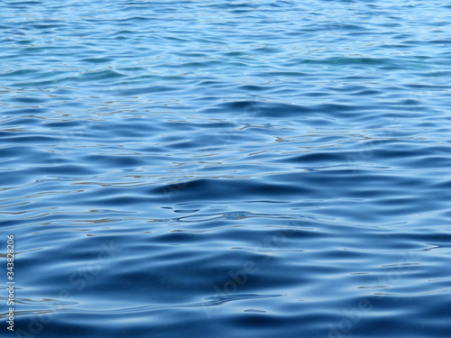 Water surface texture of deep blue sea. Soft waves  ripple water for background