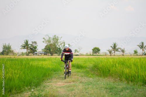 Asian men ride bicycles for exercise. Sport and active life concept.