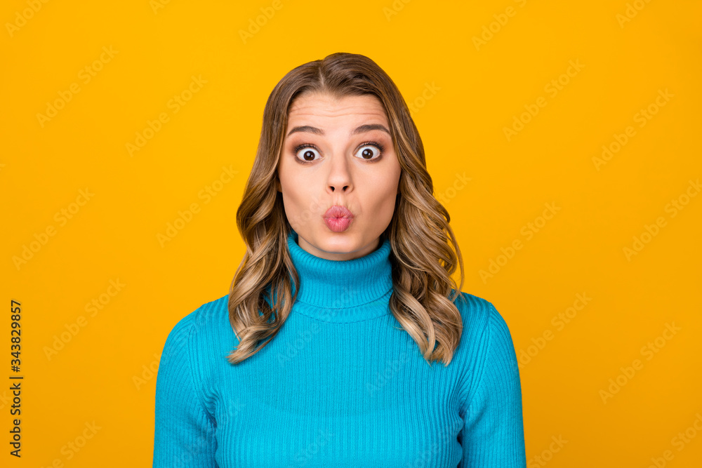 Closeup photo of attractive funny curly lady sending air kisses handsome boyfriend guy wear casual blue warm turtleneck isolated vibrant yellow color background