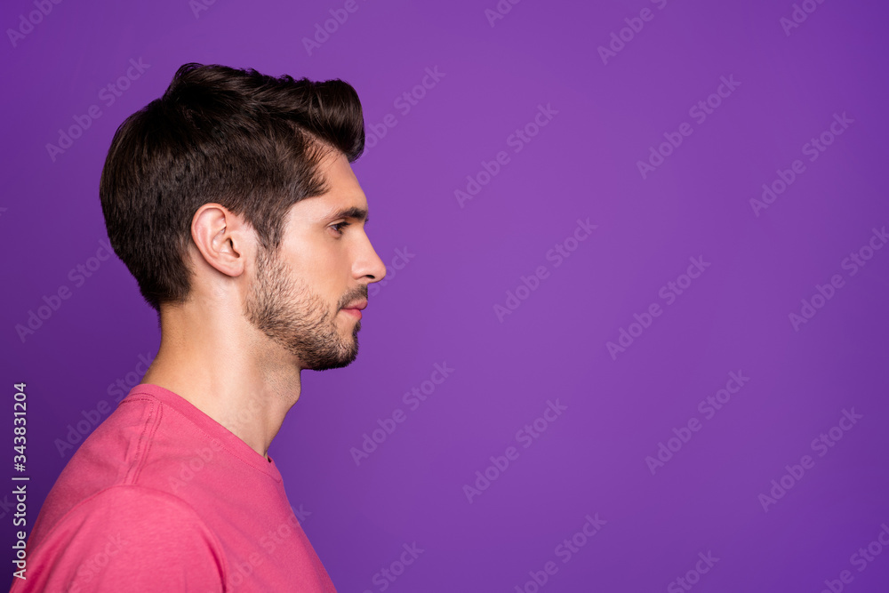 Closeup profile photo of macho guy serious perfect appearance neat hairdo bristle not smiling look side empty space wear casual pink t-shirt isolated purple color background Closeup profile photo of macho guy serious perfect appearance neat hairdo bristle not smiling look side empty space wear casual pink t-shirt isolated purple color background