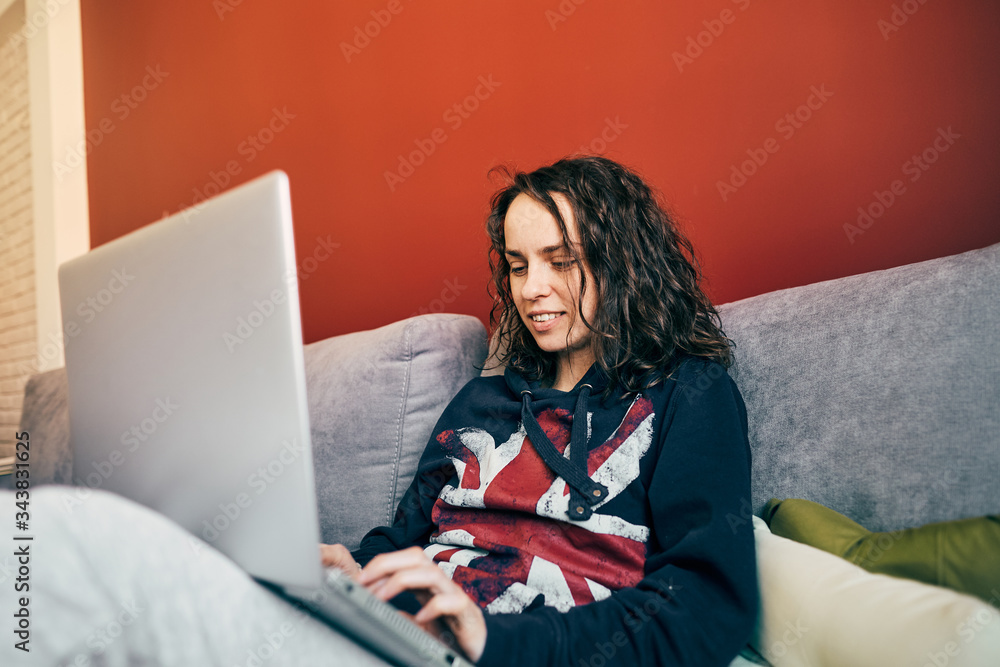 lovely female working from home using laptop while quarantine of coronavirus lovely female working from home using laptop while quarantine of coronavirus