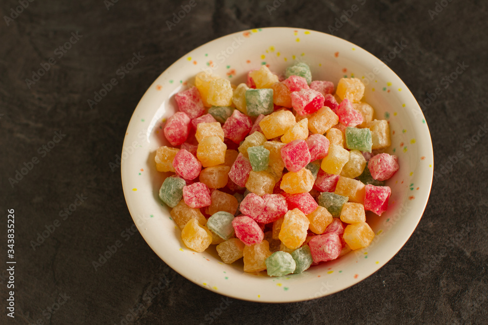 Heap of colorful Turkish sweets delight in small colorful pieces on dark
Heap of colorful Turkish sweets delight in small colorful pieces on dark