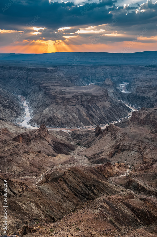 Dramatic Sunset over Fish River Canyon viewed from the main lookout near Hobas, Namibia, Africa. HDR Image