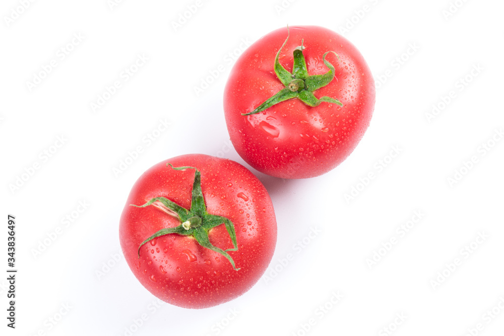 Red fresh tomatoes isolated on white background in close-up Red fresh tomatoes isolated on white background in close-up