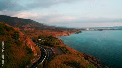 Aerial view of landscape and coastline with road seascape at sunset