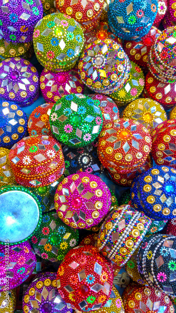 Colorful Indian jewelry and trinket boxes with mirror detail at market, London, United Kingdom.