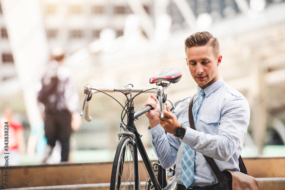 Handsome Smile Caucasian Businessman Goto Work with Bicycle in Car Free Day in the City - Urban Lifestyle Handsome Smile Caucasian Businessman Goto Work with Bicycle in Car Free Day in the City - Urban Lifestyle