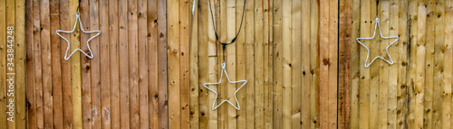 LED star decoration on wooden wall, Clapham Common, London, UK