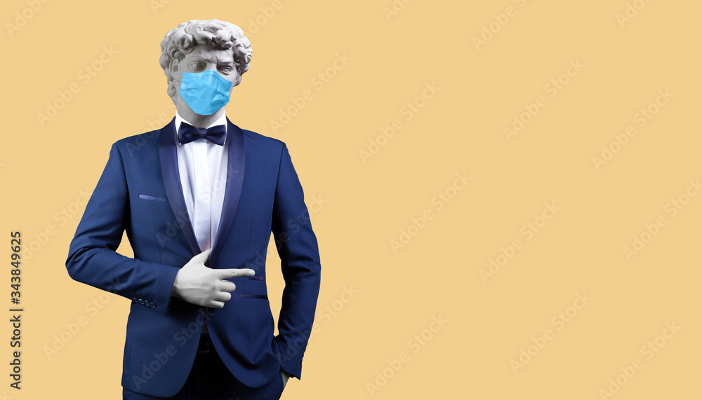 Modern art collage. Concept Gypsum head of David's Man in suit and medical mask. Modern art collage. Concept Gypsum head of David's Man in suit and medical mask.