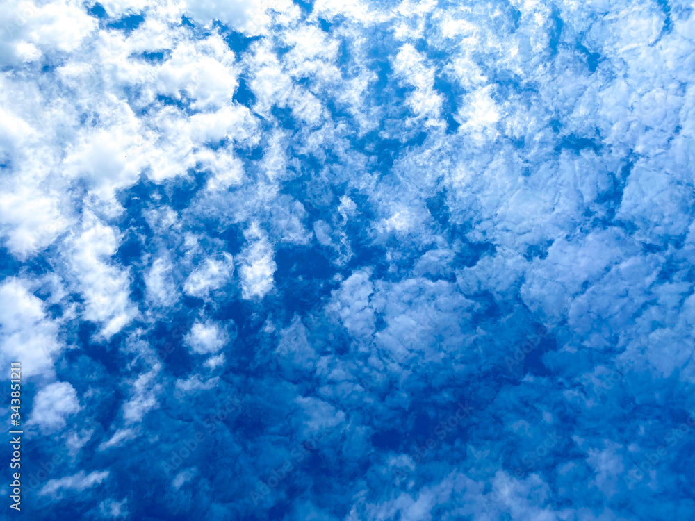 Texture of clouds on blue sky illuminated by sunlight. Blue sky white clouds ,Abstract nature ,Textured pattern background ,gradient. Texture of clouds on blue sky illuminated by sunlight. Blue sky white clouds ,Abstract nature ,Textured pattern background ,gradient.