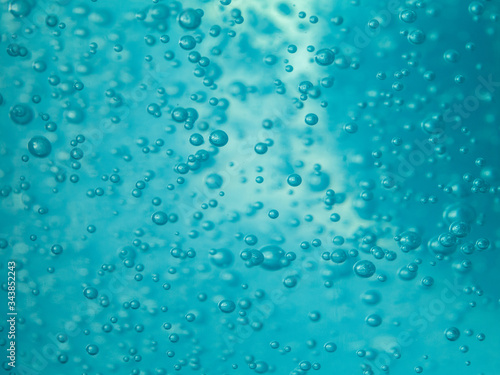 close up blue alcohol sanitizer gel with air bubble inside