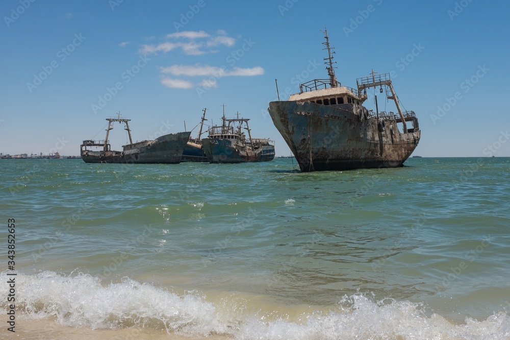 Shipwreck Graveyard with Several Abandoned Rusty Fishing Trawlers near Nouadhibou, Mauritania Shipwreck Graveyard with Several Abandoned Rusty Fishing Trawlers near Nouadhibou, Mauritania