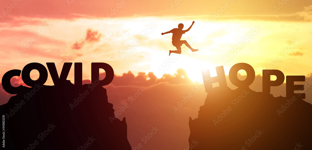 Silhouette man jumps to survive from corona virus , COVID-19. The concept of humankind that must overcome this epidemic crisis. Fight and escape from Covid with hope. Silhouette man jumps to survive from corona virus , COVID-19. The concept of humankind that must overcome this epidemic crisis. Fight and escape from Covid with hope.
