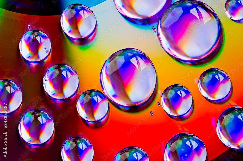 Large drops of water with reflections photographed on a plastic surface. Large drops of water with reflections photographed on a plastic surface.