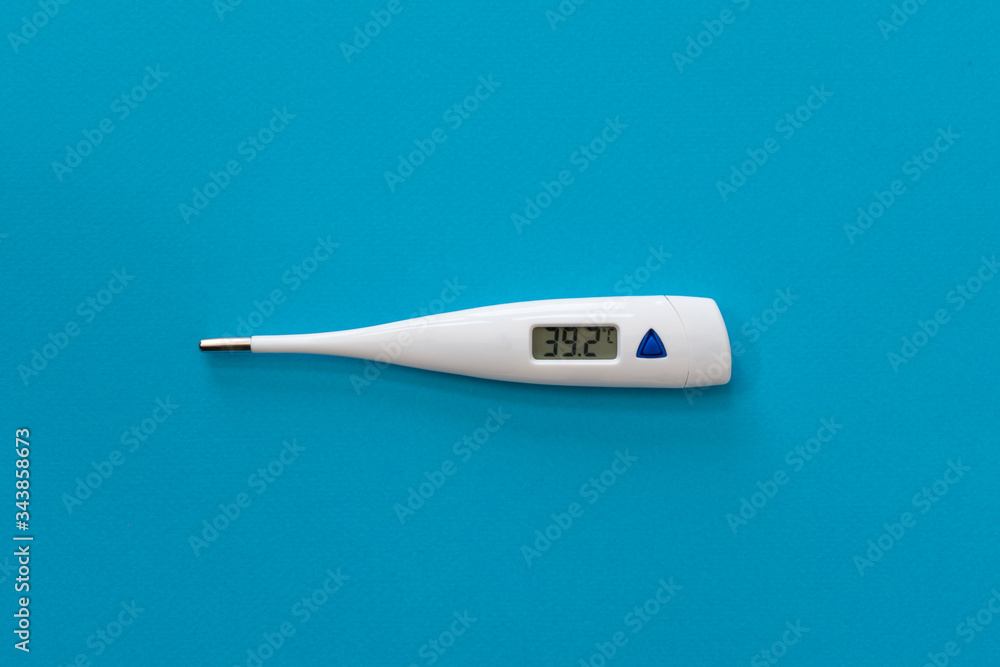 Digital thermometer isolated on blue background with temperature on, copy space Digital thermometer isolated on blue background with temperature on, copy space