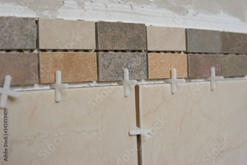 diy tiling in progress in domestic bathroom