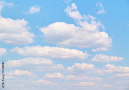Fototapeta Naklejka Na Ścianę i Meble -  Soft vanilla clouds floating in the blue sky