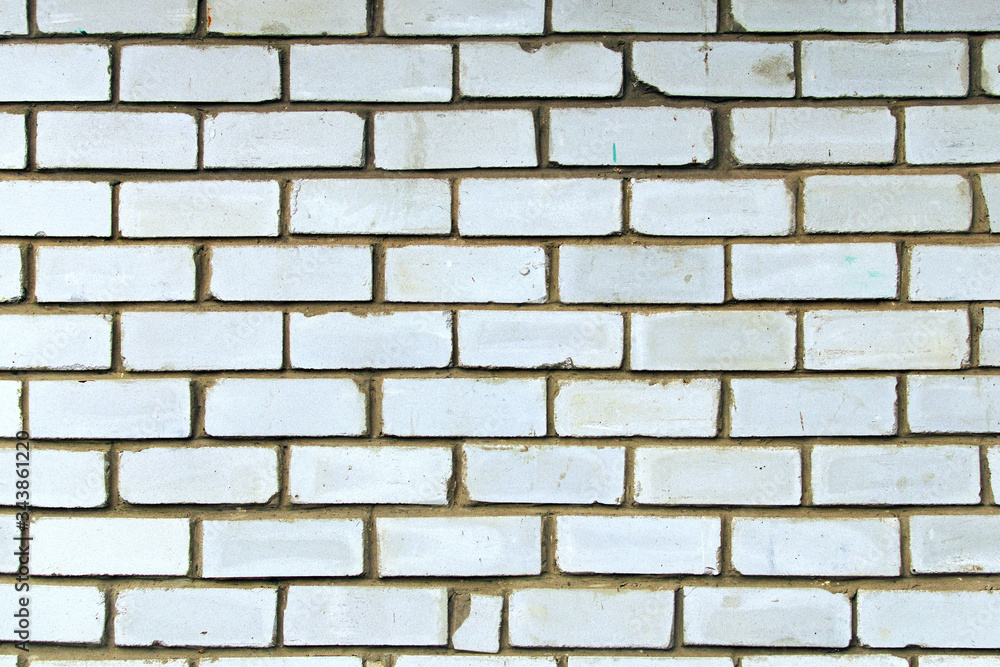 Obraz premium Background of white brick wall texture. Close-up view of cement bonded brick wall. Brick wall with different white colors stones. Outdoor and indoor interiors. Stone block seamless background