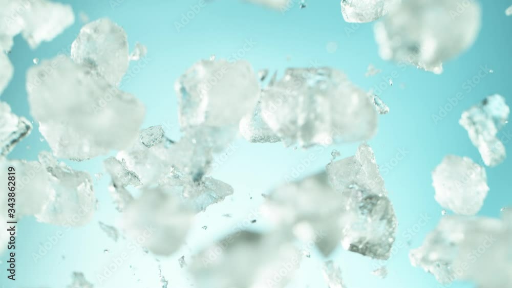 Super slow motion of falling ice cubes separated on blue background. Filmed on high speed cinema camera, 1000 fps. Super slow motion of falling ice cubes separated on blue background. Filmed on high speed cinema camera, 1000 fps.