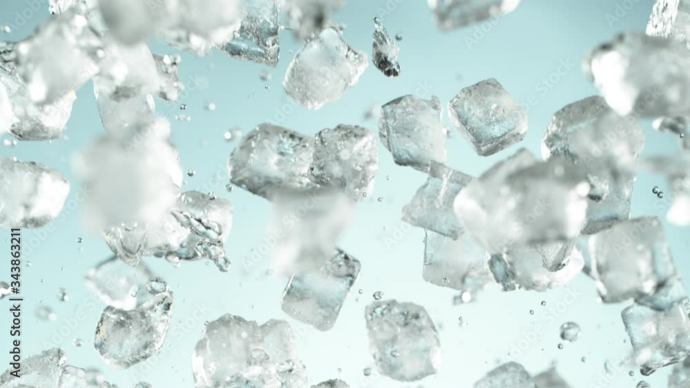 Super slow motion of falling ice cubes separated on blue background. Filmed on high speed cinema camera, 1000 fps. Super slow motion of falling ice cubes separated on blue background. Filmed on high speed cinema camera, 1000 fps.