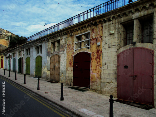 Colorful doors. Warehouses in the old port. Old city of Valletta. Malta Island.