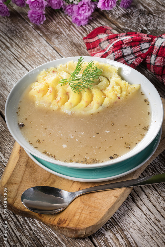 Pure white borscht served with mashed potatoes. Pure white borscht served with mashed potatoes.