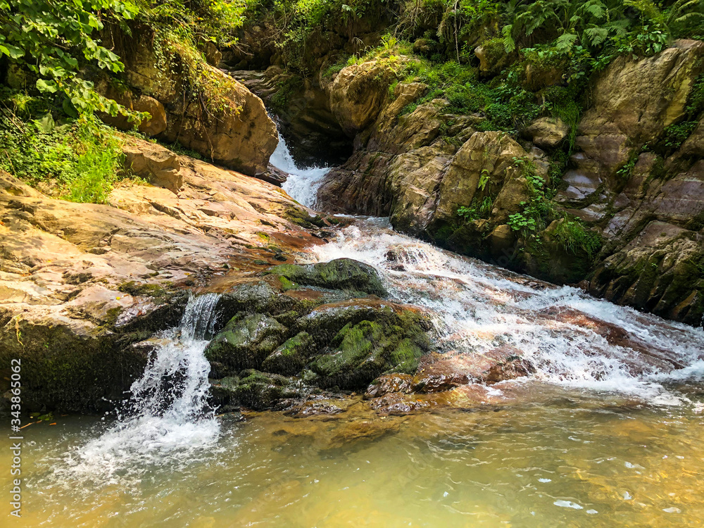 Fototapeta premium Mountain waterfall in Krasnaya Polyana, Sochi