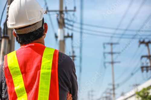Engineering is checking progress on building construction of power plants,Young engineer standing at the substation.