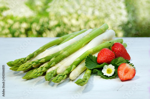 green and white asparagus with strawberries, copy space
