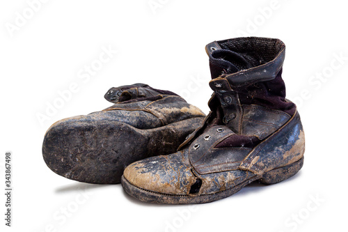  Old and torn boots isolated on white background
