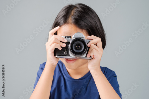 Young Photographer Take Old Camera © patpitchaya