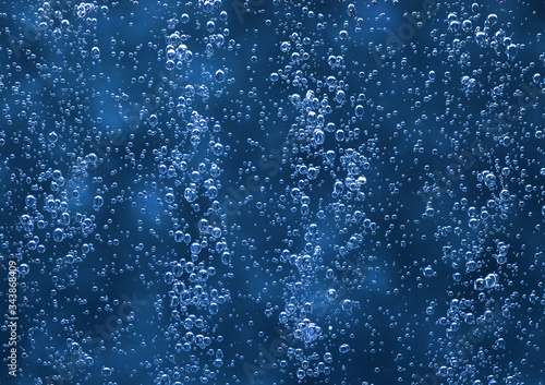 Texture effervescent bubbles on a blue background.