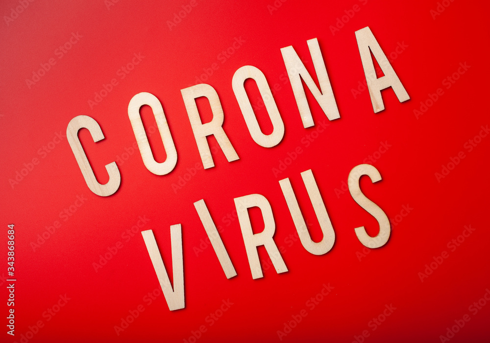 coronavirus word text wooden letter on red background corona virus covid-19 coronavirus word text wooden letter on red background corona virus covid-19