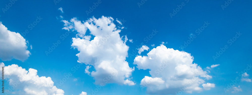 Panorama blue sky background with tiny clouds.Blue backdrop in the air. Abstract style for text.